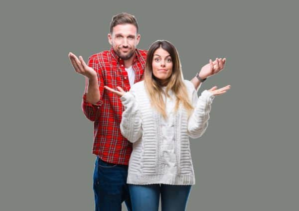 CoupleLookingConfusedGreyBackground